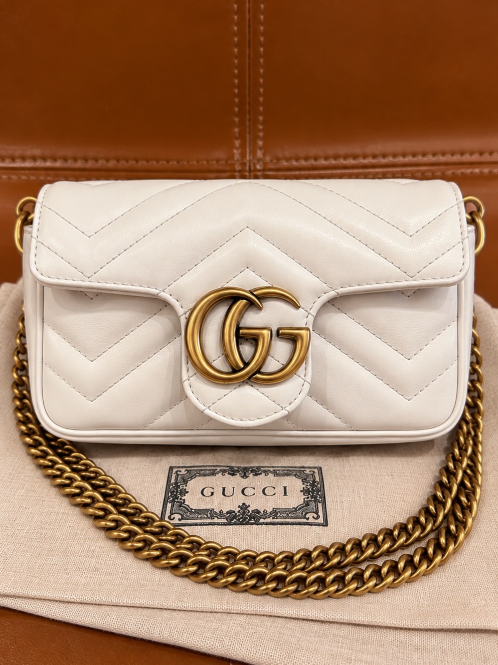 Authentic Gucci GG Marmont Super Mini White Matelassé Leather Crossbody Bag